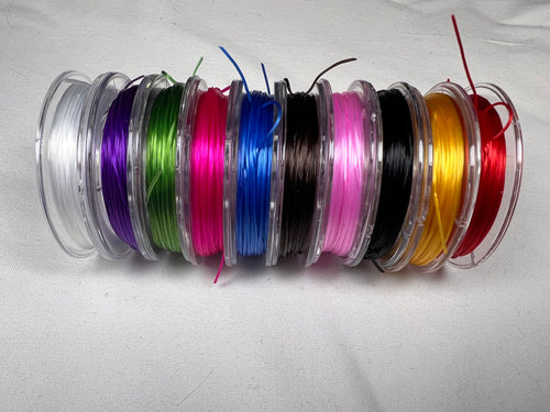 Ten rolls of 0.8mm colored elastic string in mixed colors.