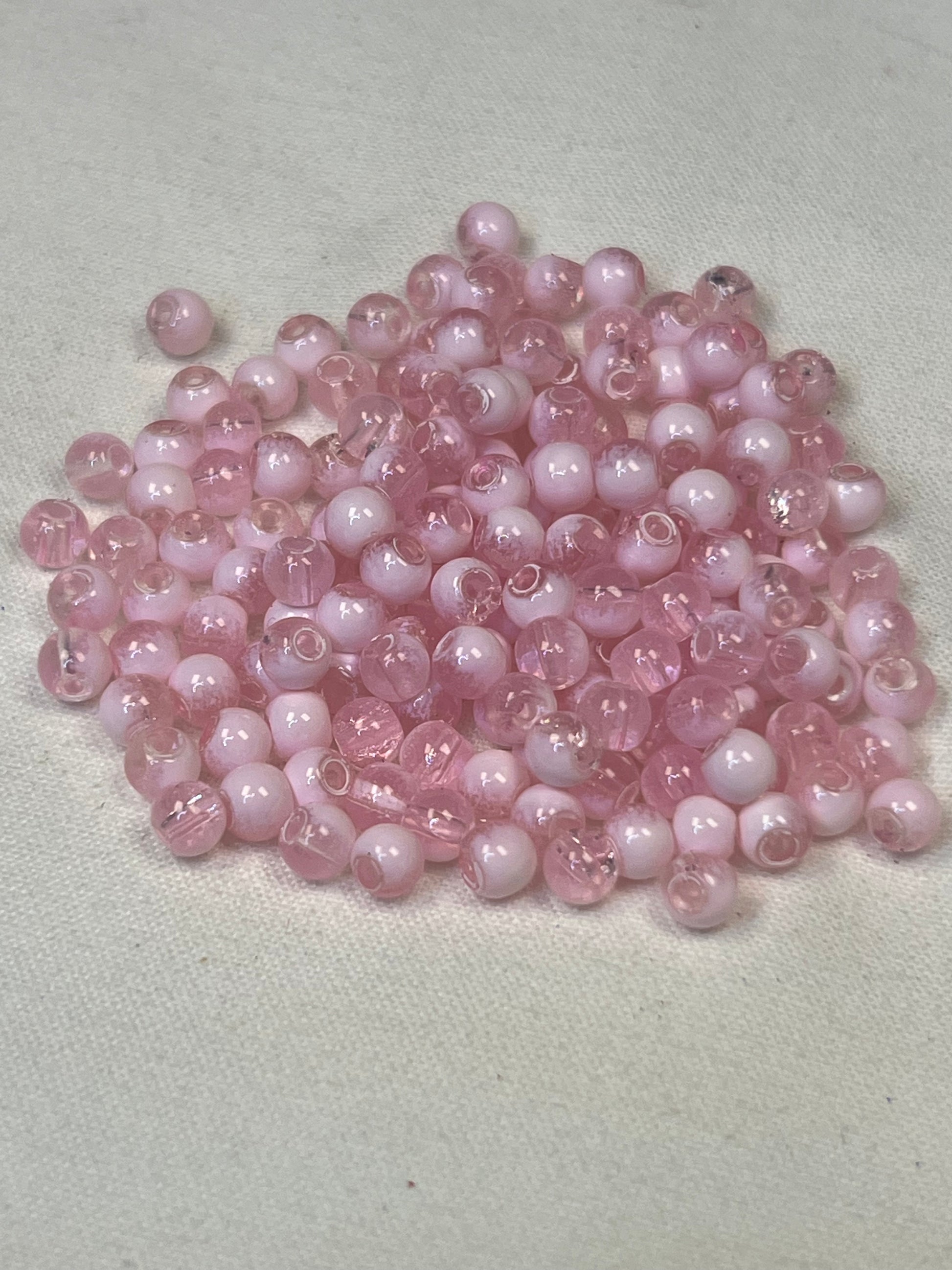 300 4.5mm two-tone crackle glass beads in flamingo pink and white.