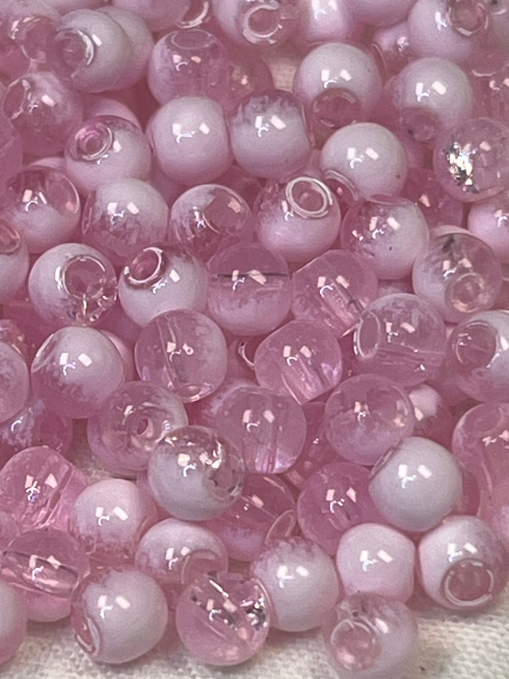 300 4.5mm two-tone crackle glass beads in flamingo pink and white.