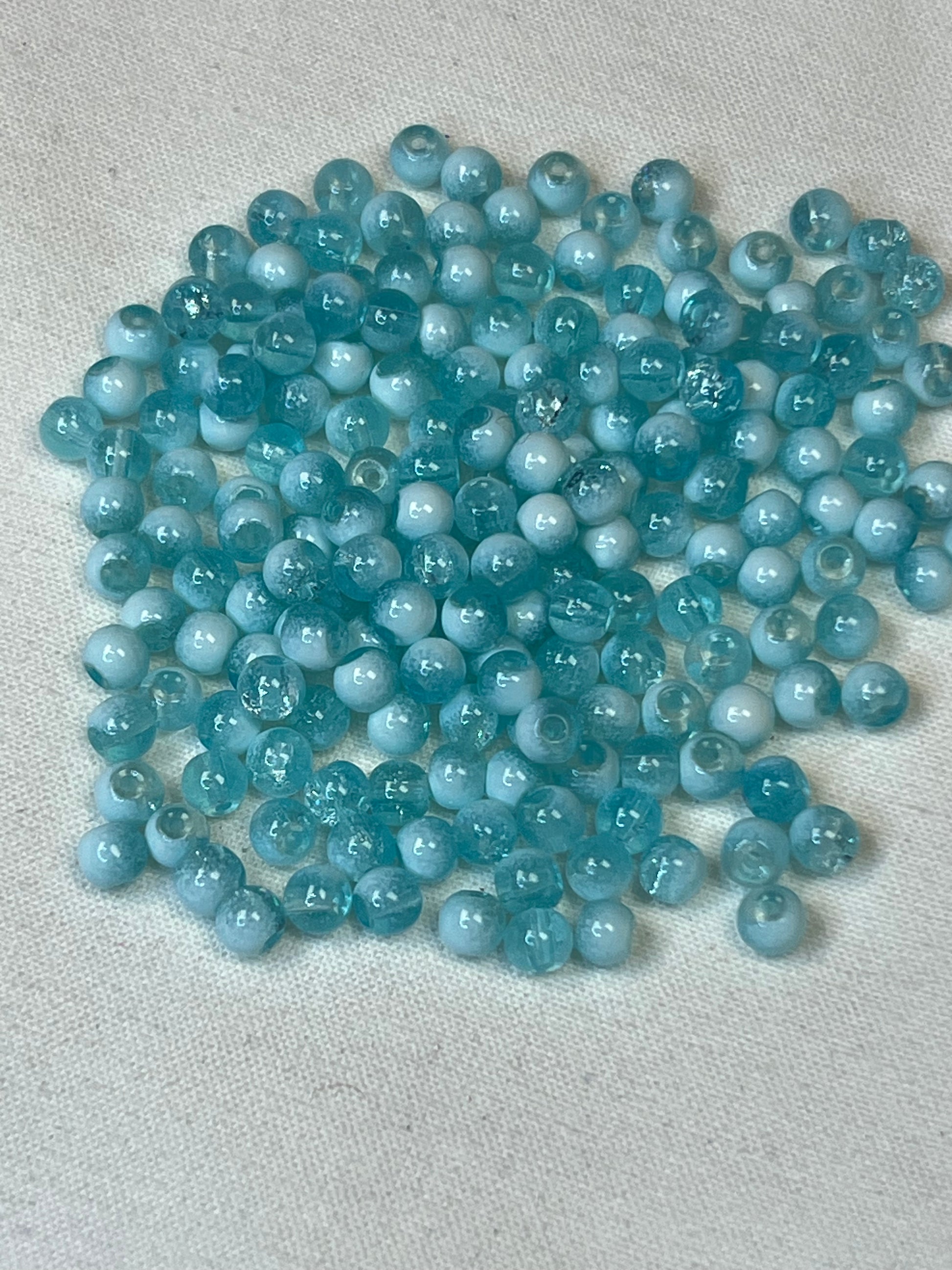 300 4.5mm two-tone crackle glass beads in turquoise and white.
