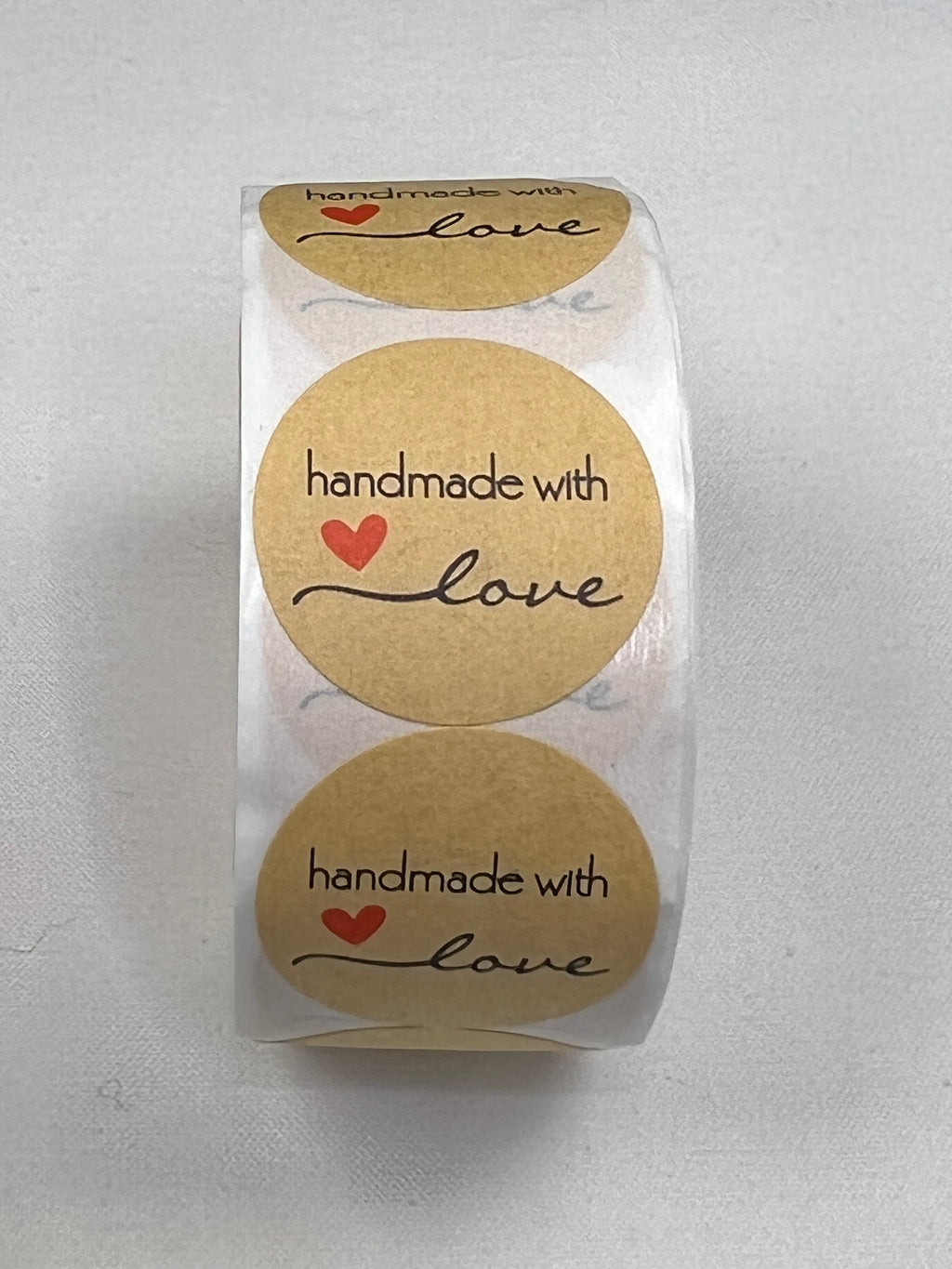 Kraft paper stickers with "handmade with love" and a red heart.