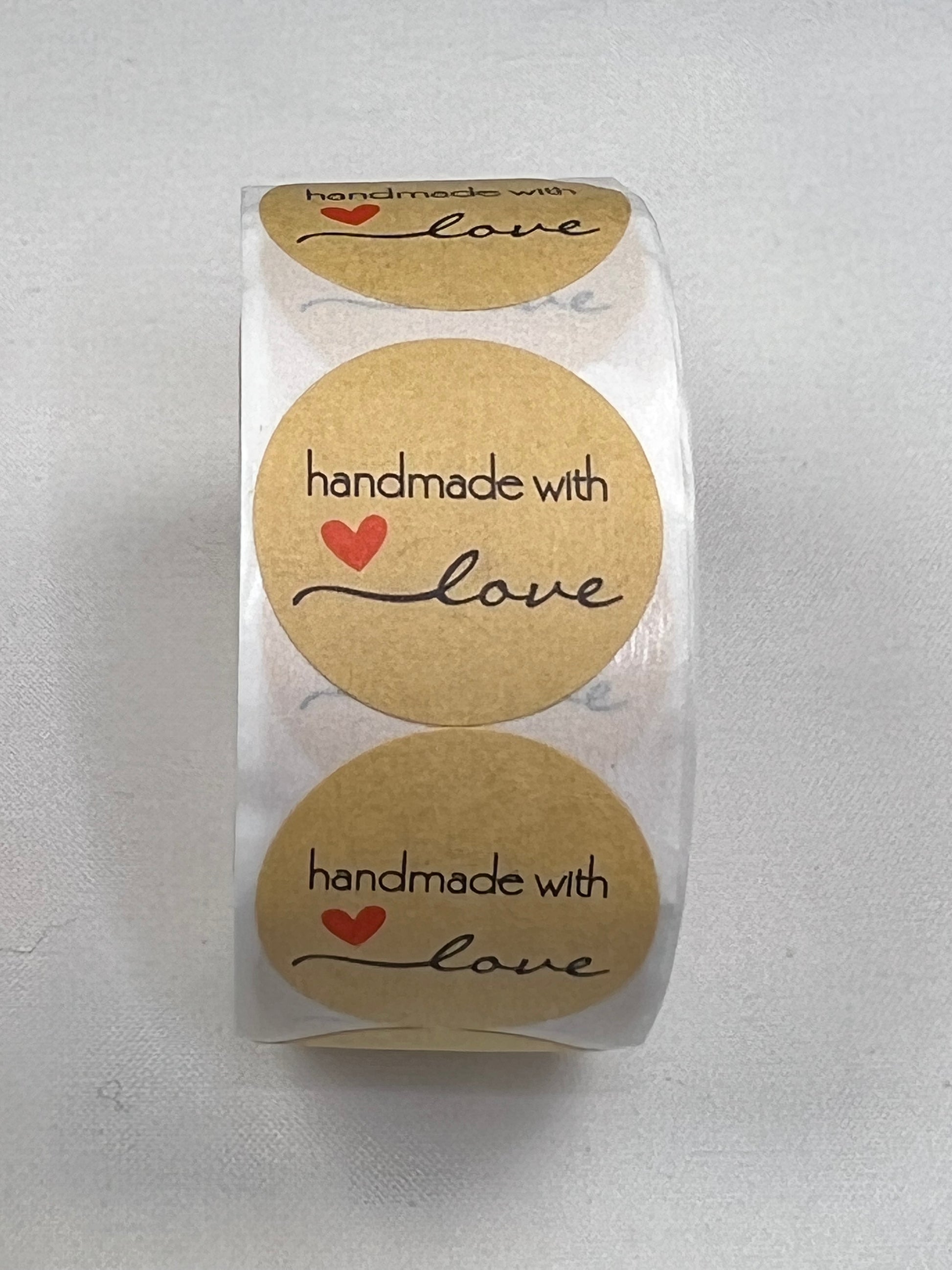 Kraft paper stickers with "handmade with love" and a red heart.