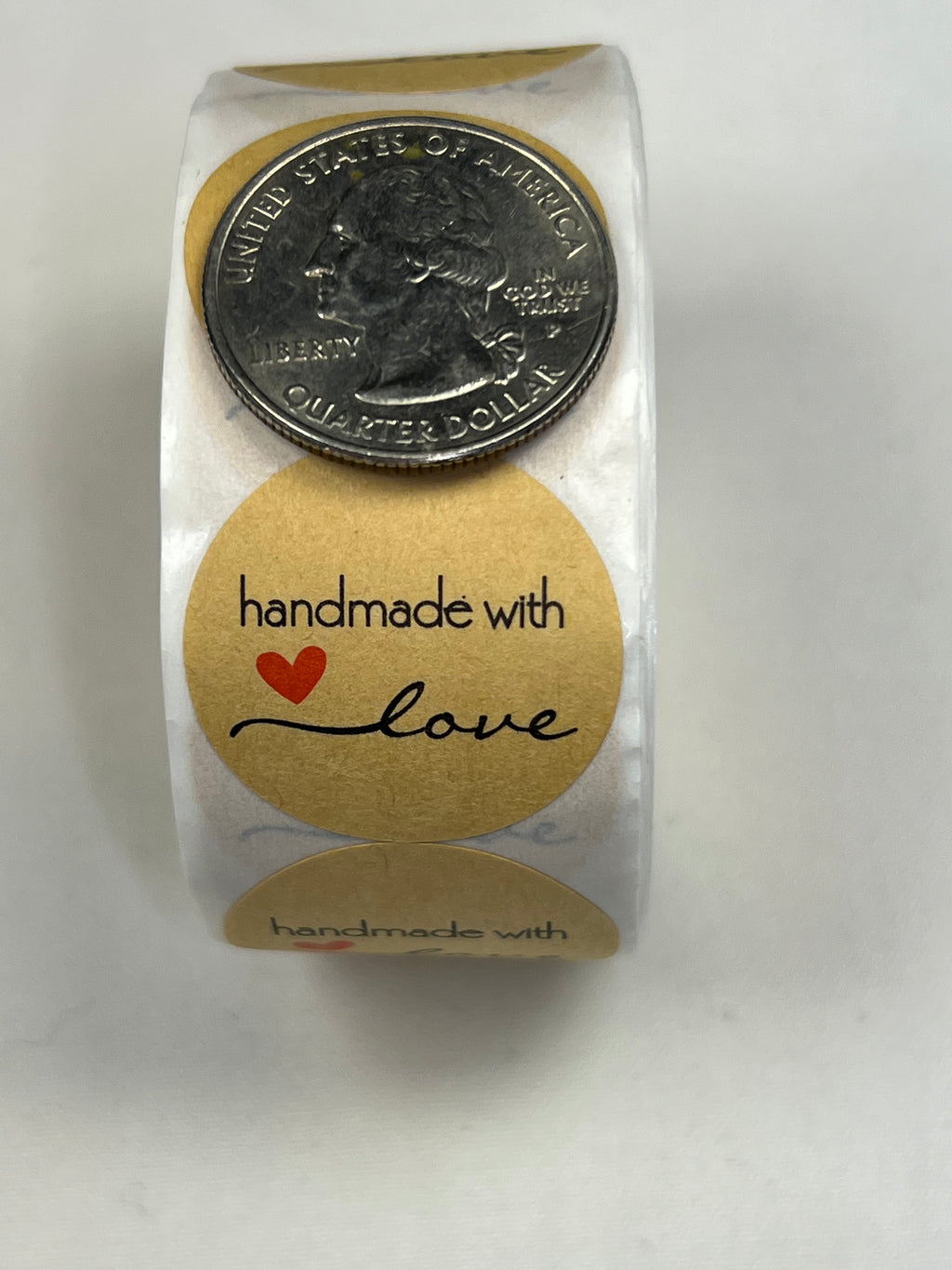 Kraft paper stickers with "handmade with love" text and a red heart.