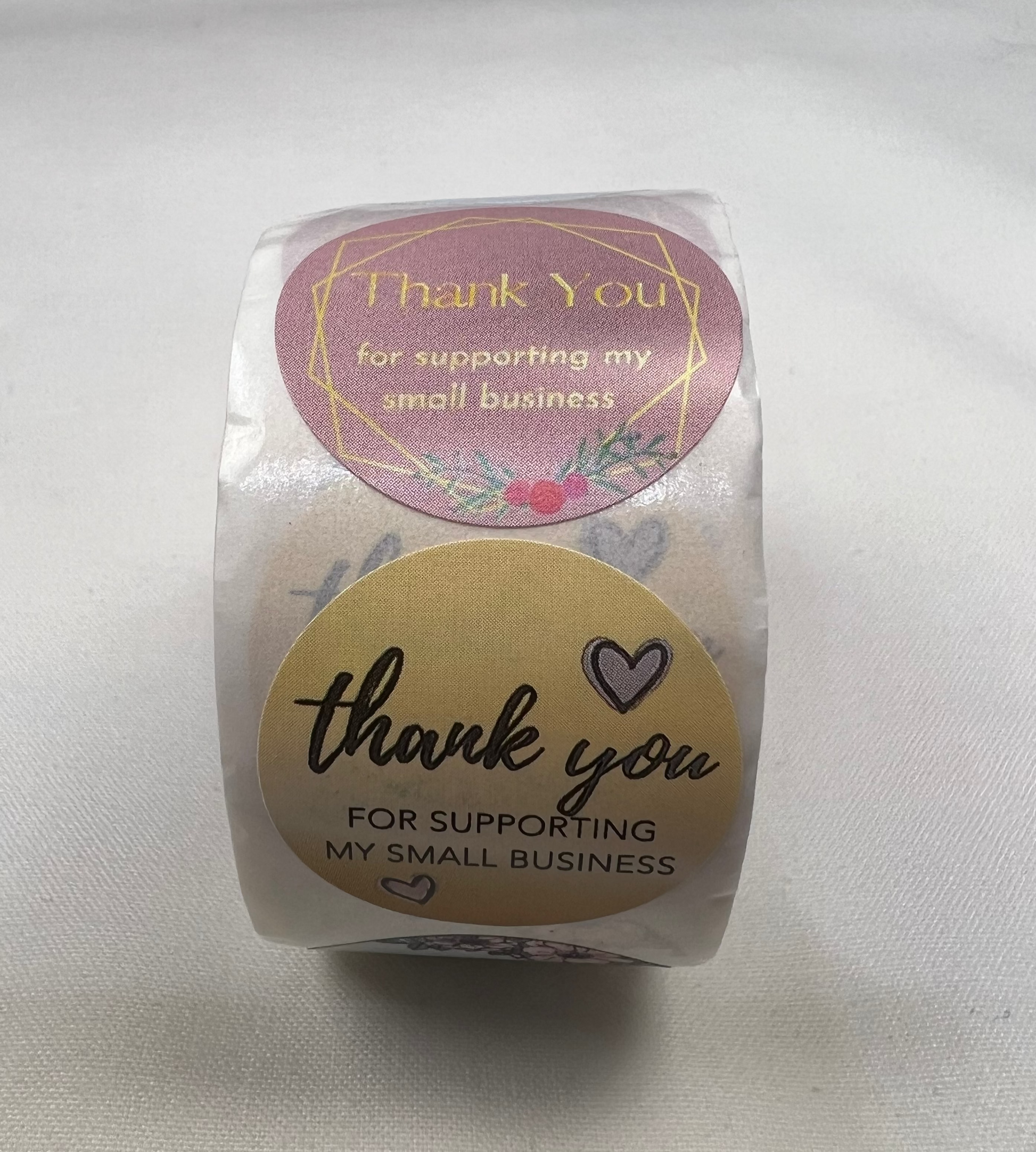 A roll of 1-inch "Thank You for Supporting My Small Business" stickers in two patterns.
