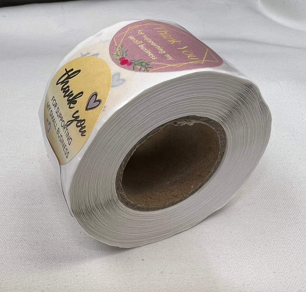 A roll of 1-inch "Thank You for Your Business" stickers with three different patterns.