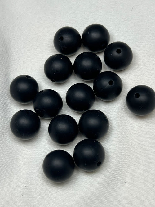 15mm black silicone beads with 2mm holes.