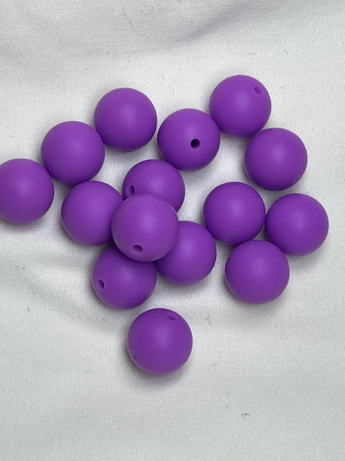 Fifteen 15mm purple silicone beads with a 2mm hole.