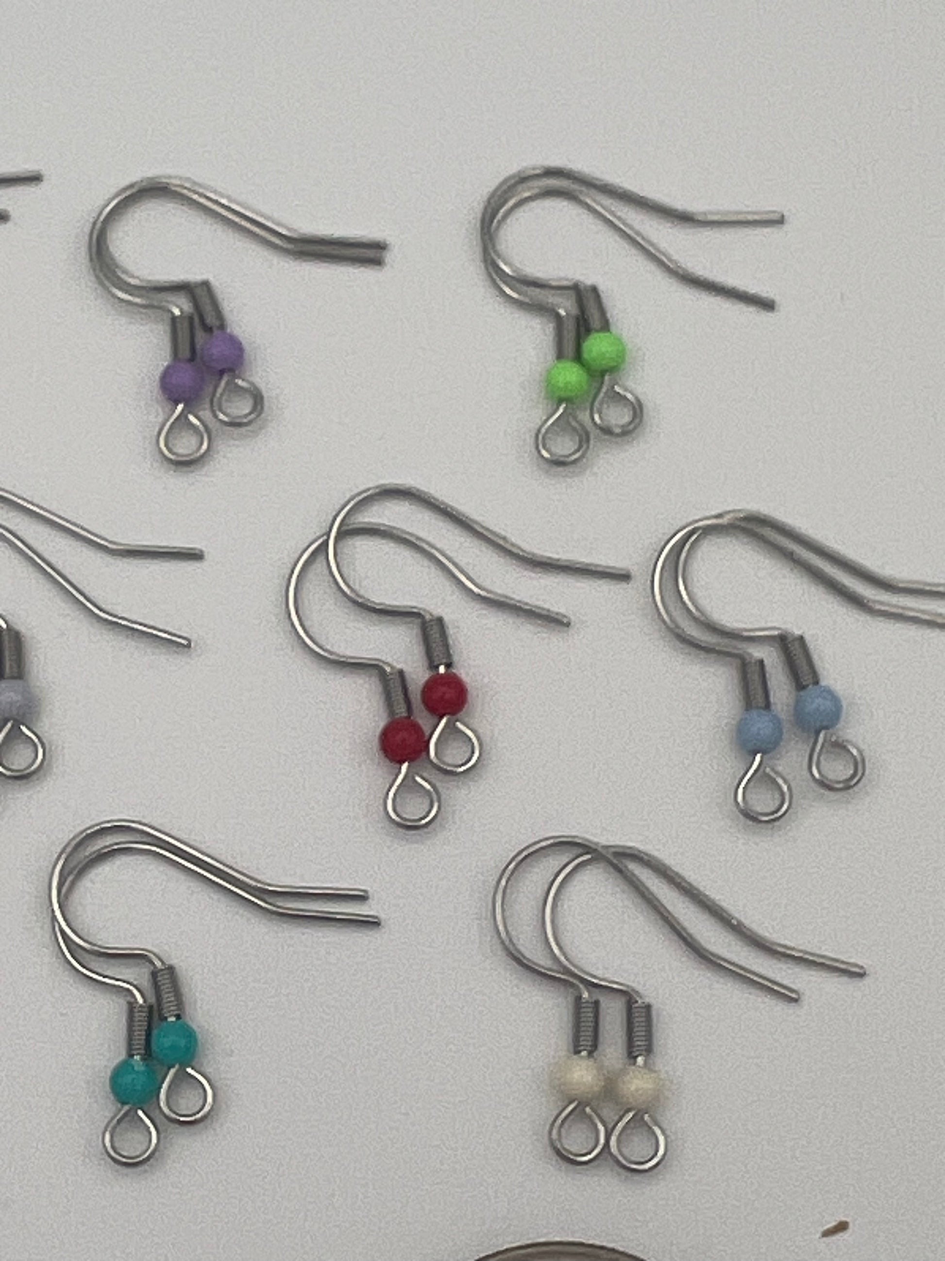 Stainless steel ear wires with acrylic beads in various colors.