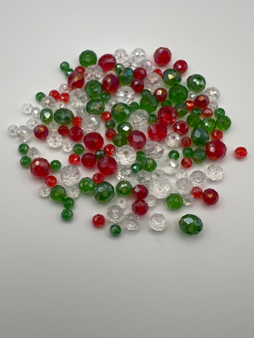 Christmas faceted rondelle glass beads in red, green, and clear.