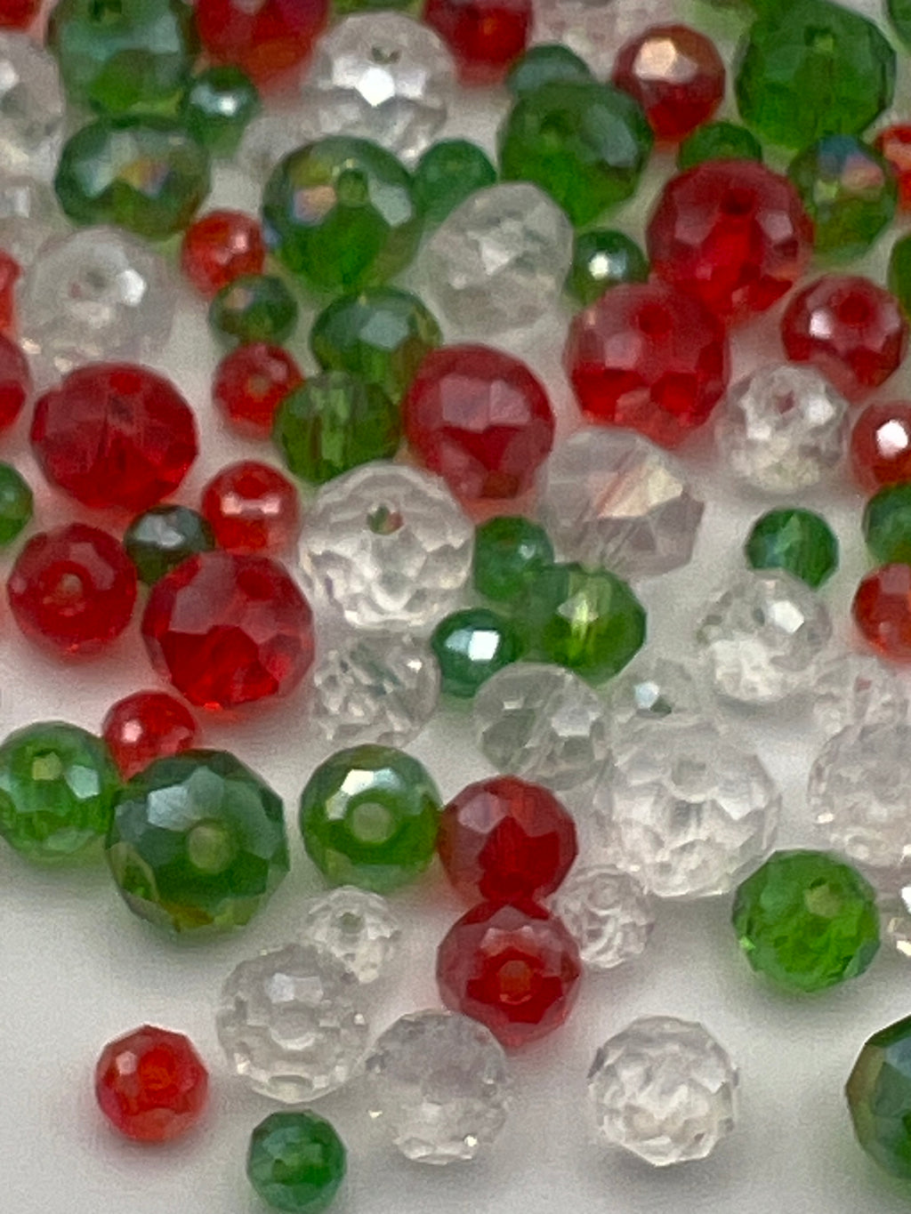 Christmas faceted glass beads in red, green, and clear.