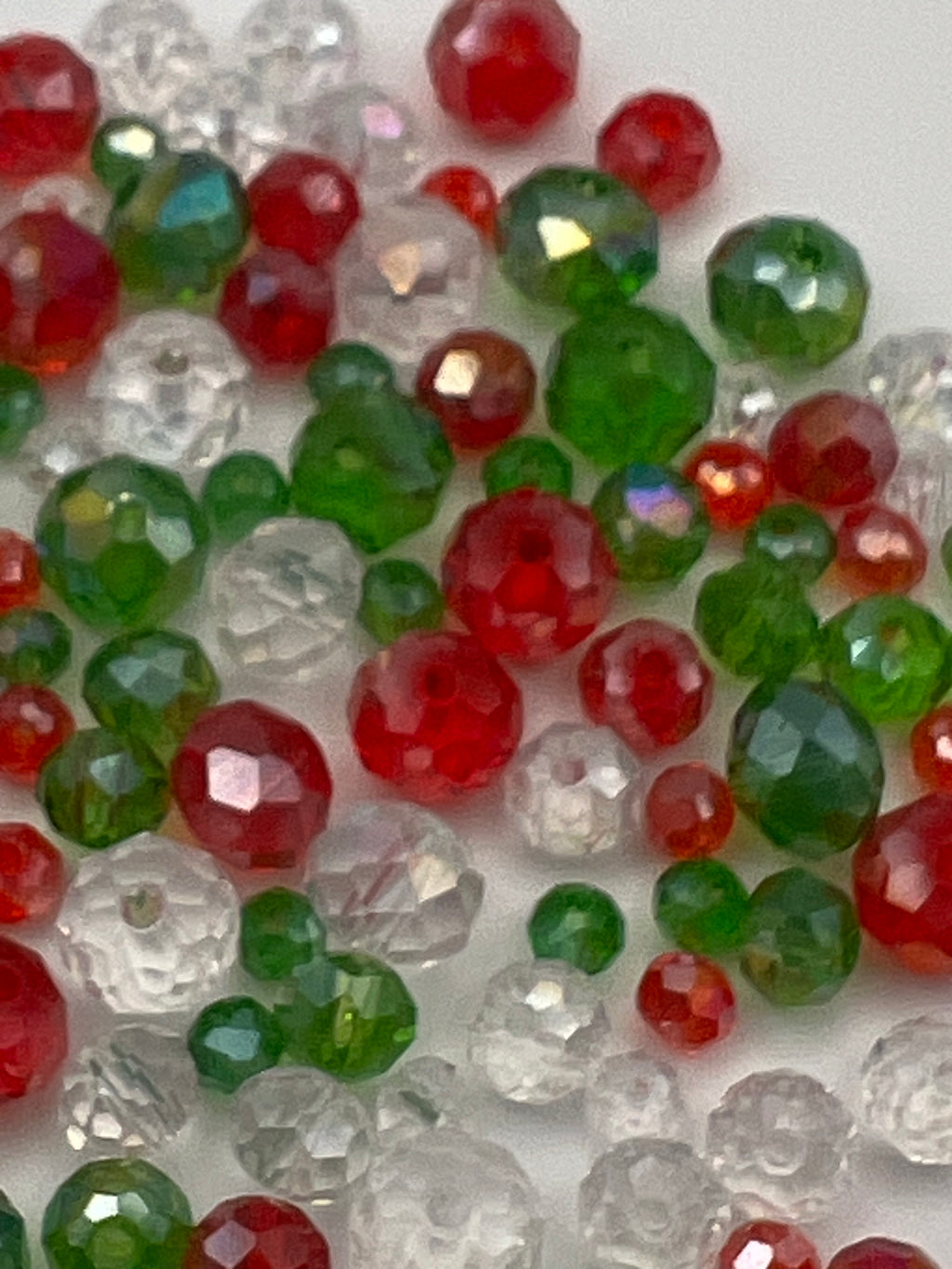 Christmas faceted rondelle glass beads in red, green, and clear.