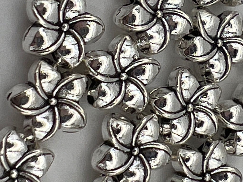 Tibetan style antique silver plumeria flower beads.