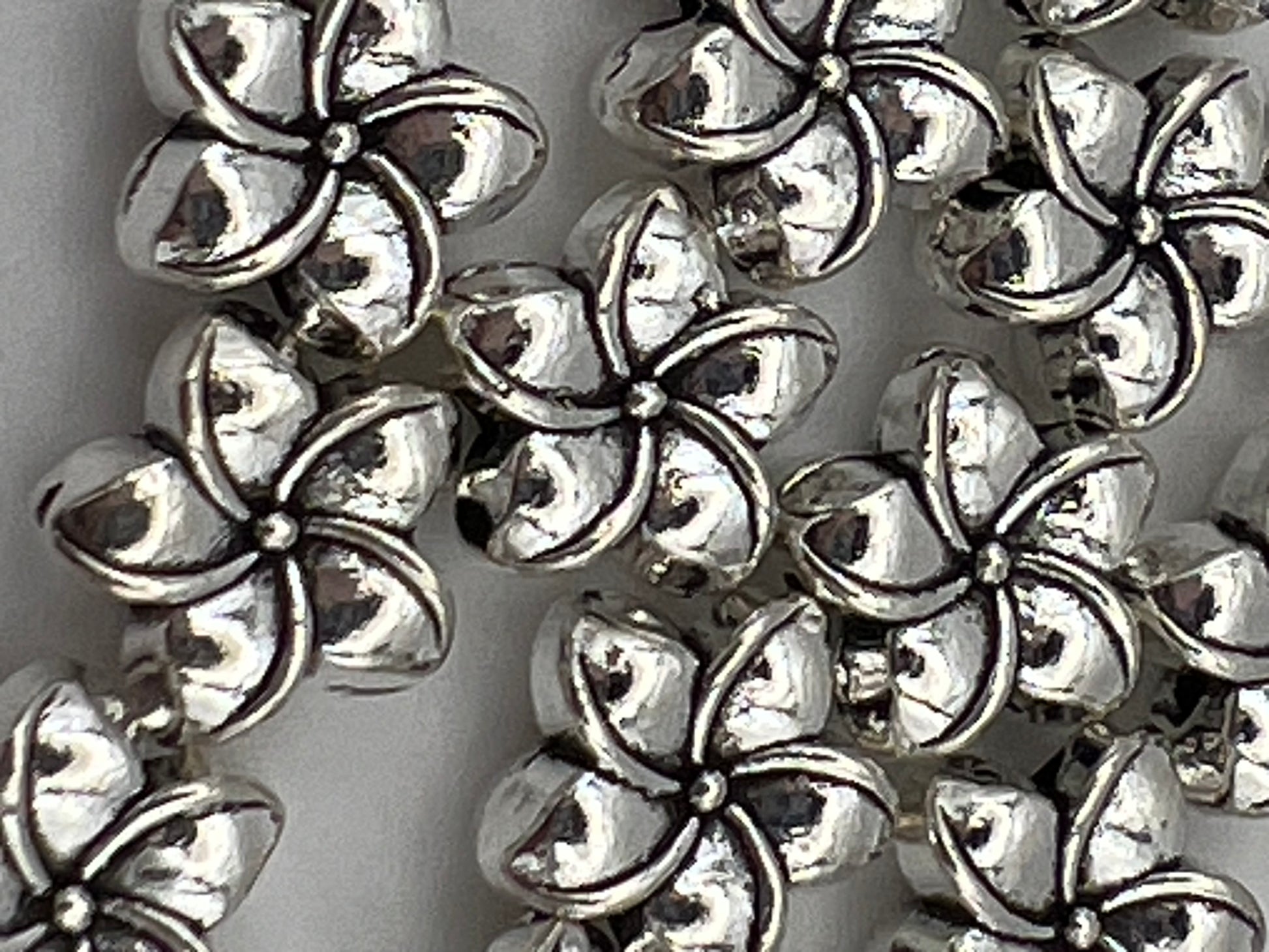 Tibetan style antique silver plumeria flower beads.