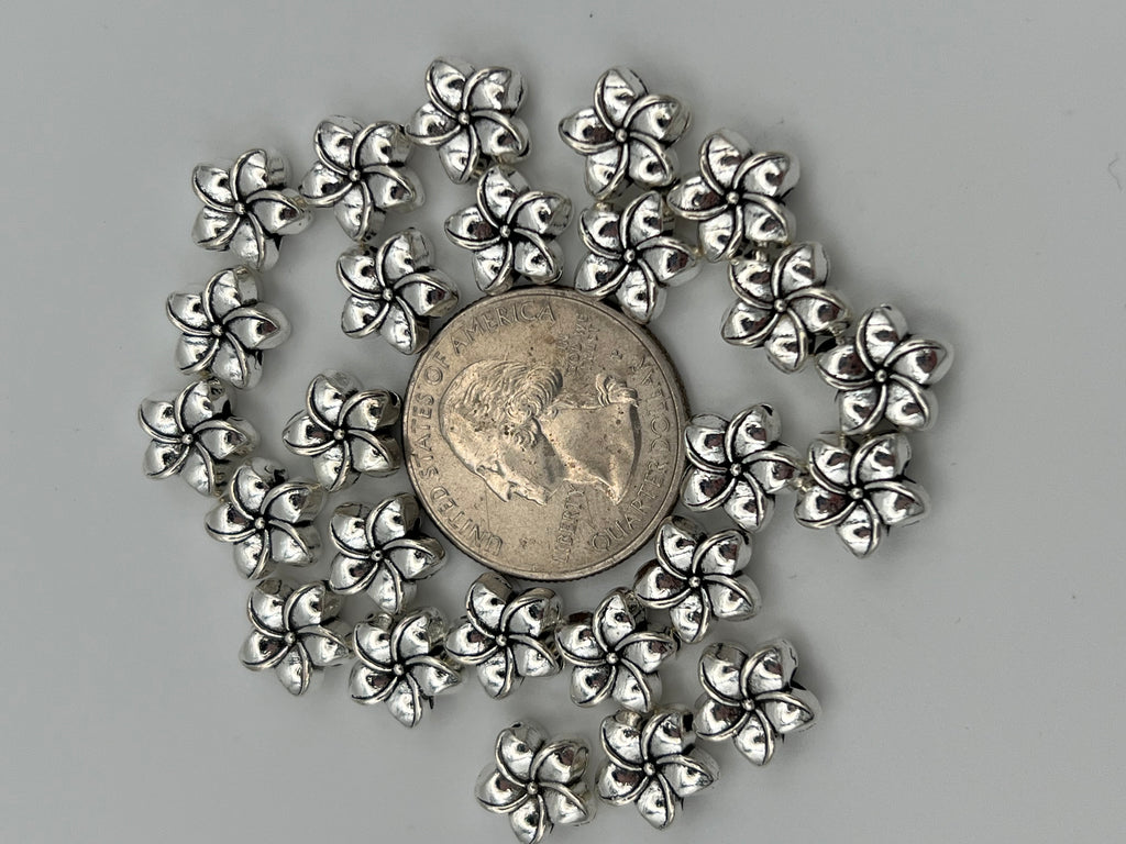 25 antique silver Tibetan style plumeria flower beads.