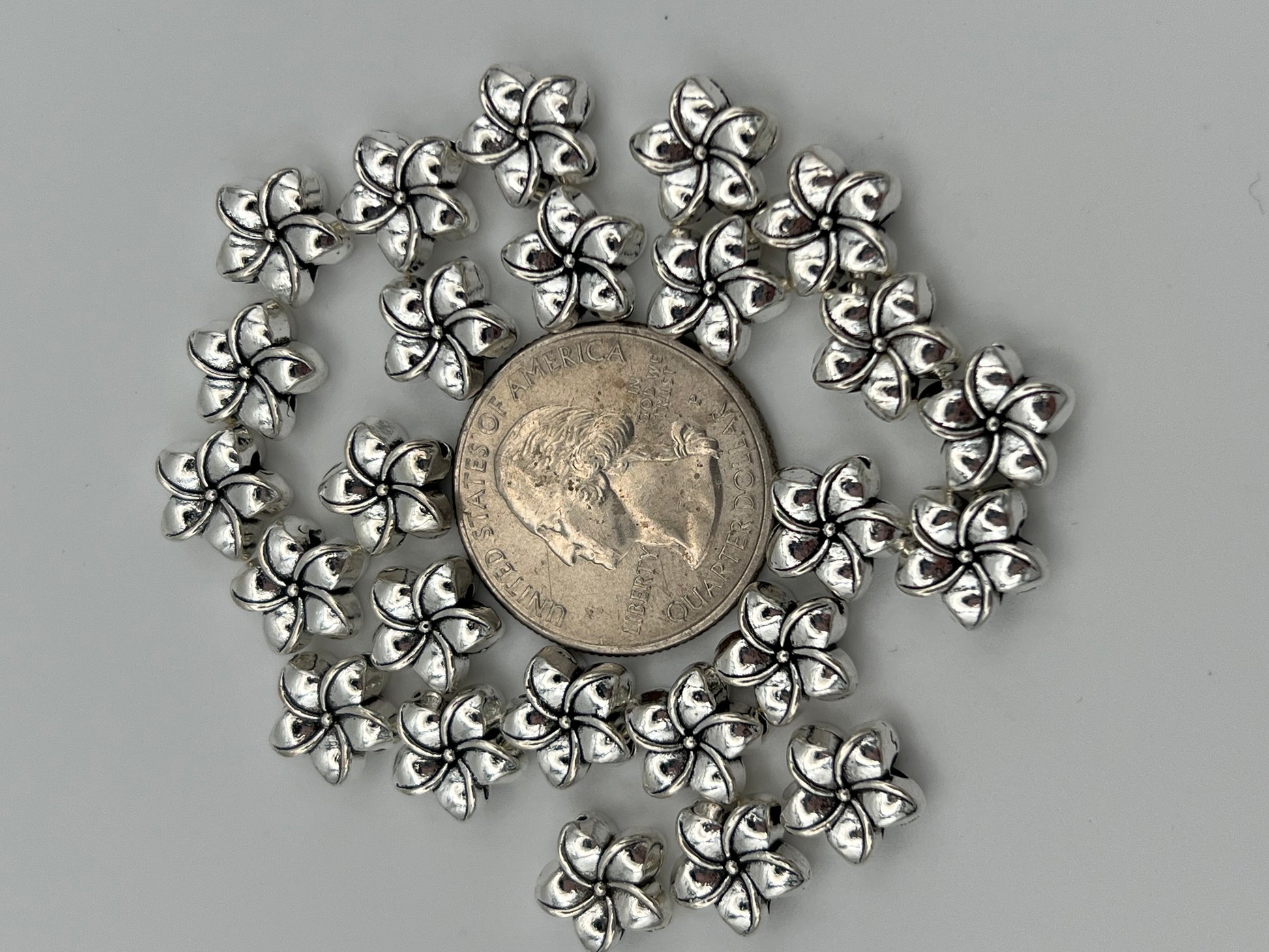25 antique silver Tibetan style plumeria flower beads.