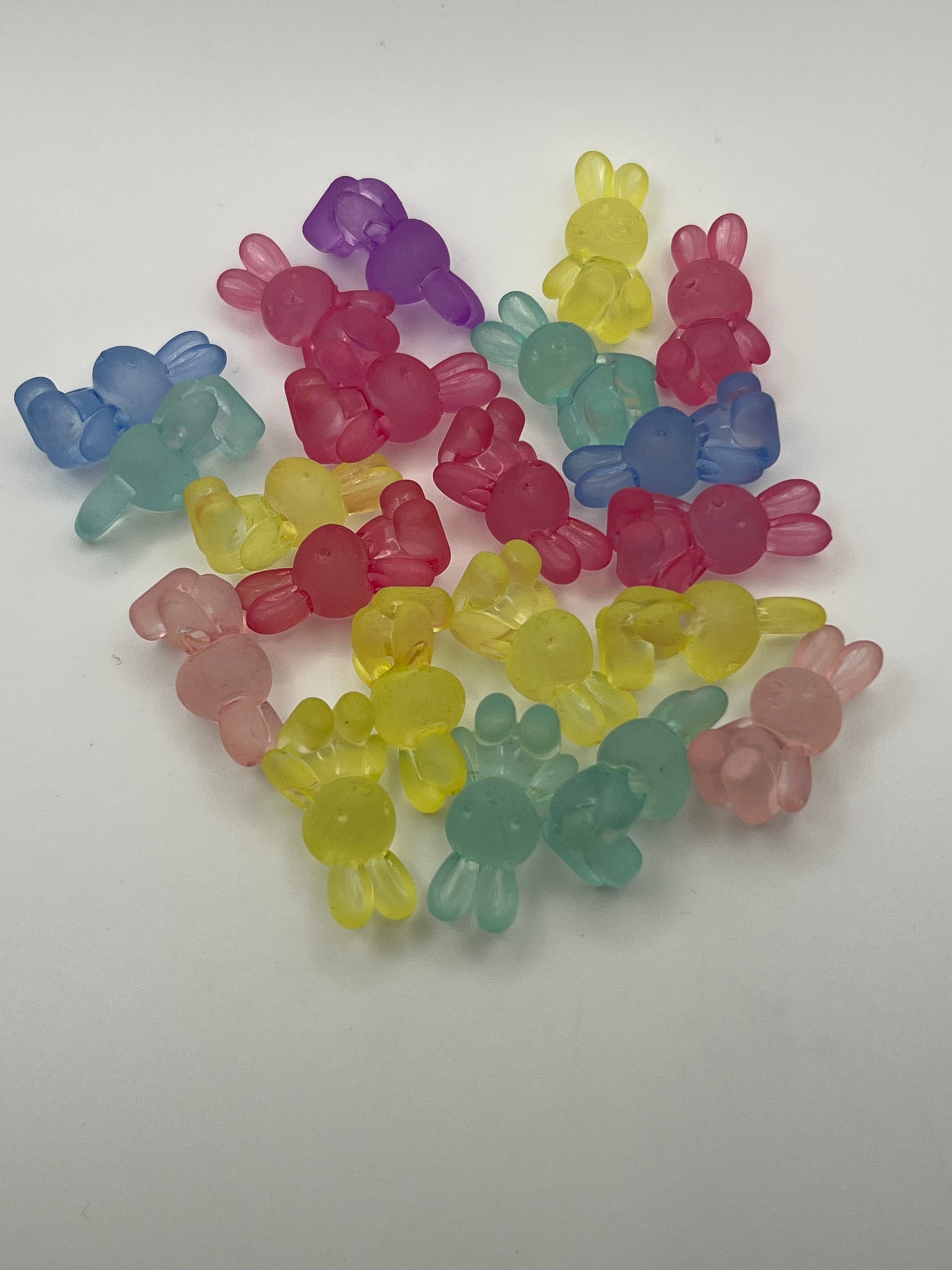 Frosted acrylic bunny beads in assorted pastel colors.