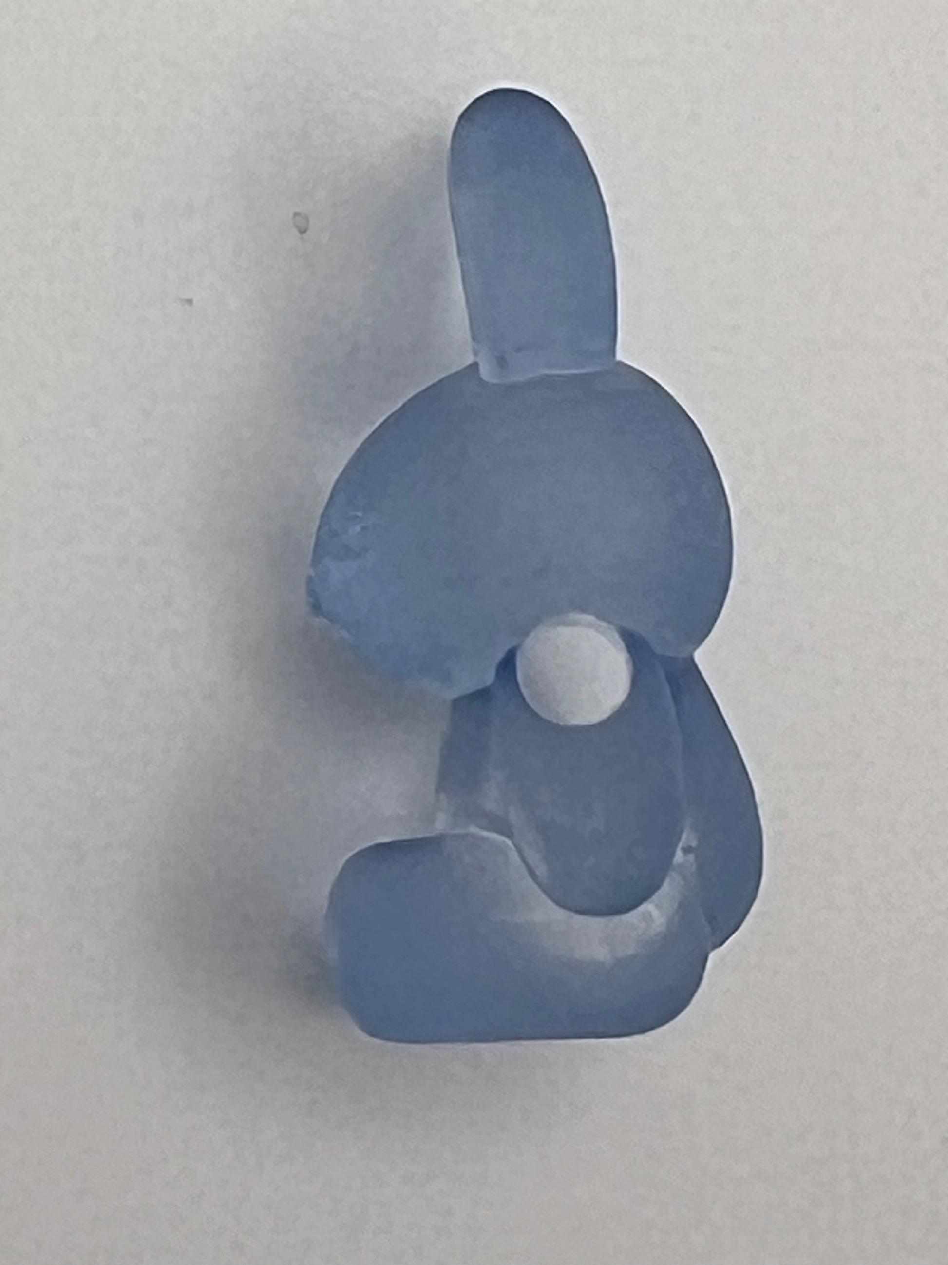 Frosted acrylic bunny bead in a light blue color.