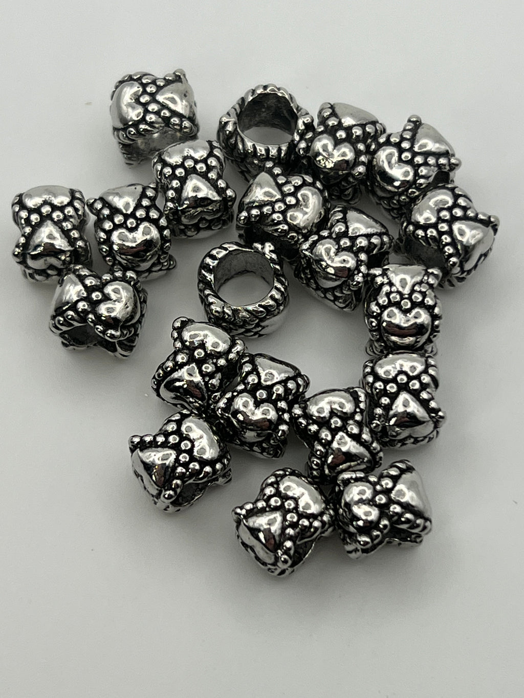 Tibetan style European beads with heart and rabbit or cat faces.