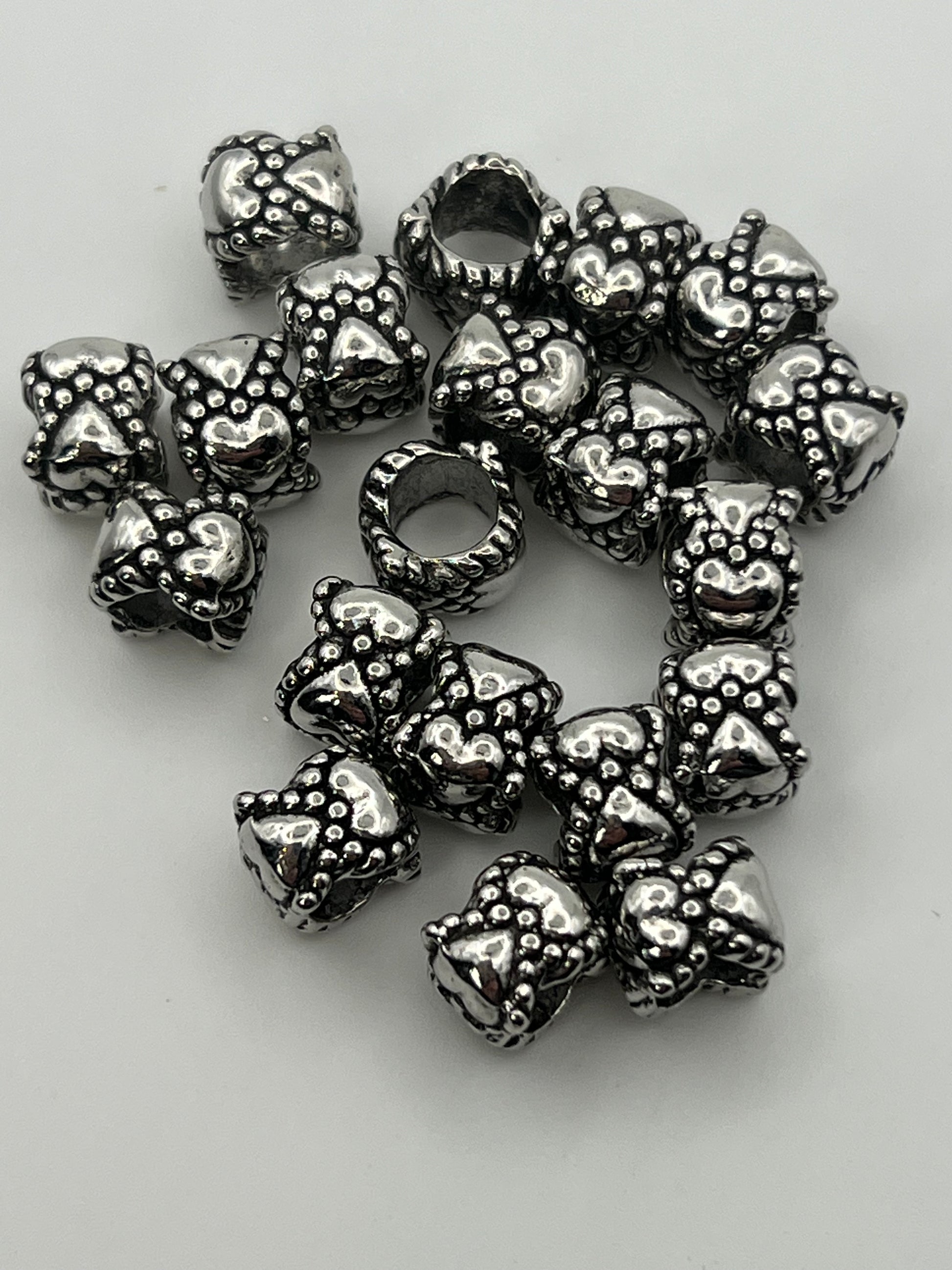 Tibetan style European beads with heart and rabbit or cat faces.
