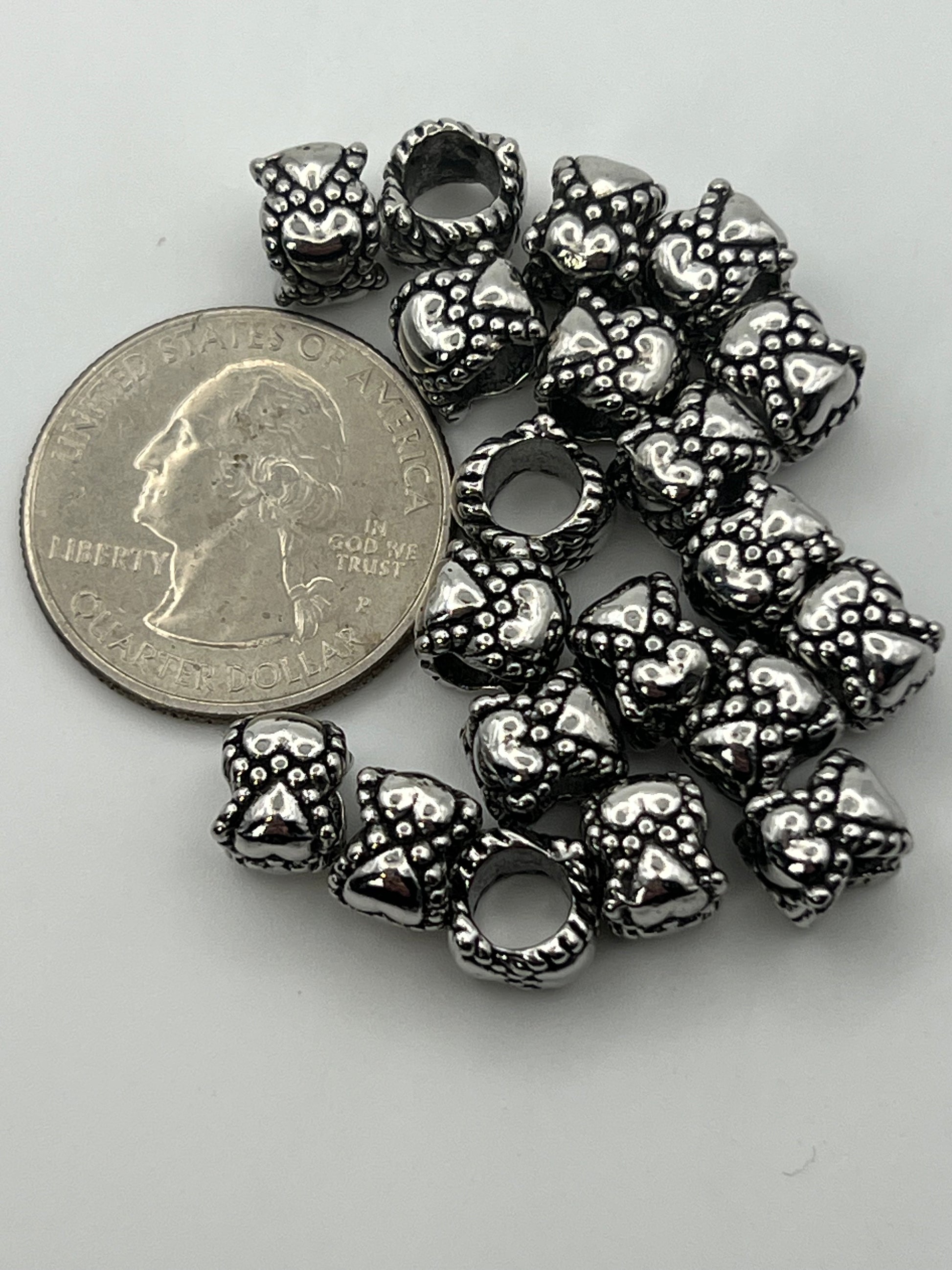 Tibetan style heart European beads with a 5mm hole.