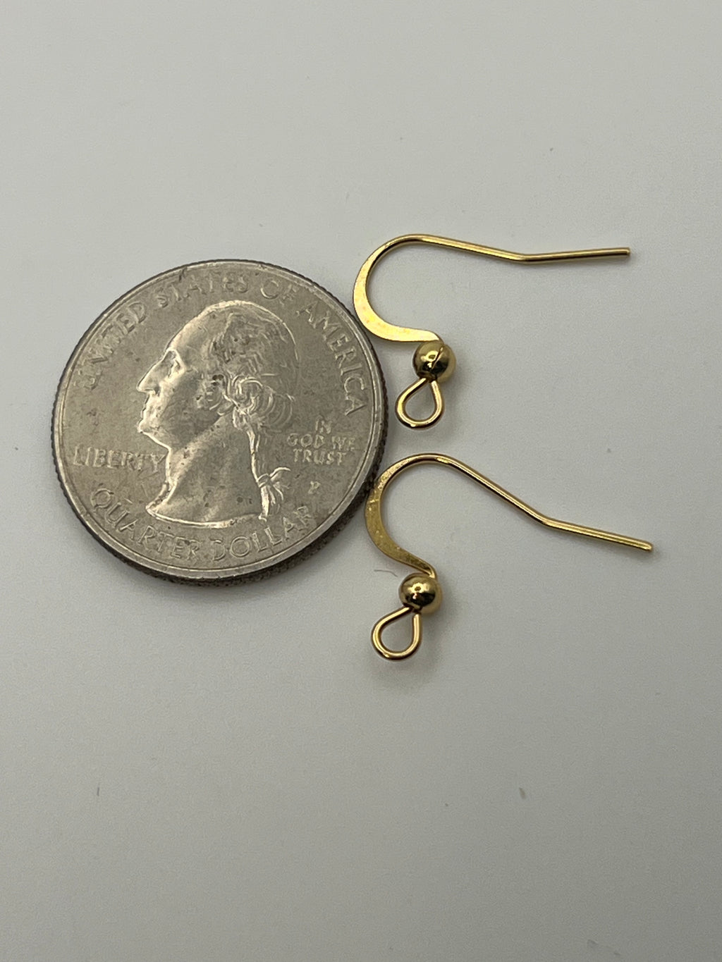 10 pairs of 18k gold plated stainless steel flat earring hooks with horizontal loops.