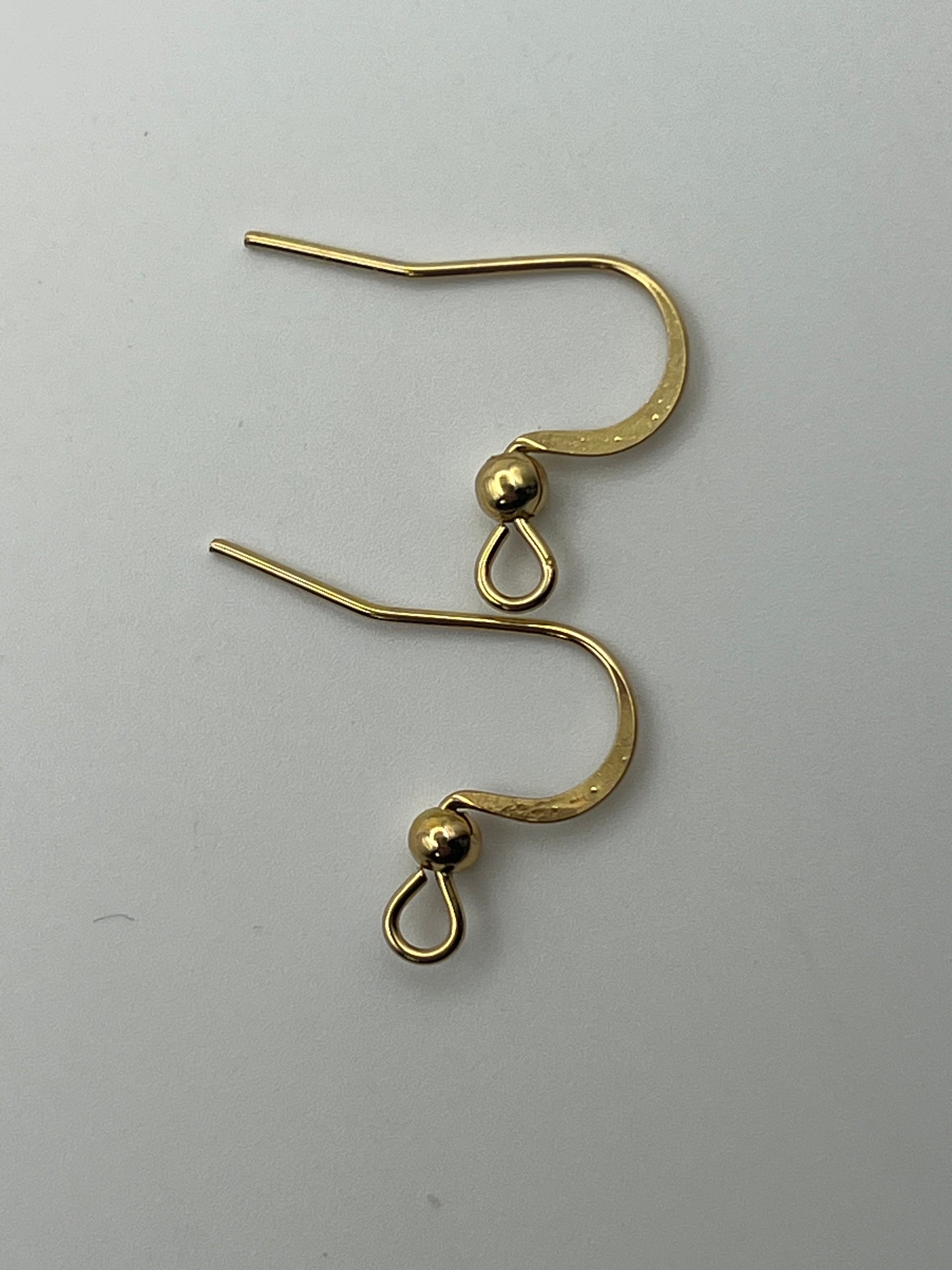 Two gold-plated stainless steel earring hooks with a bead and loop.