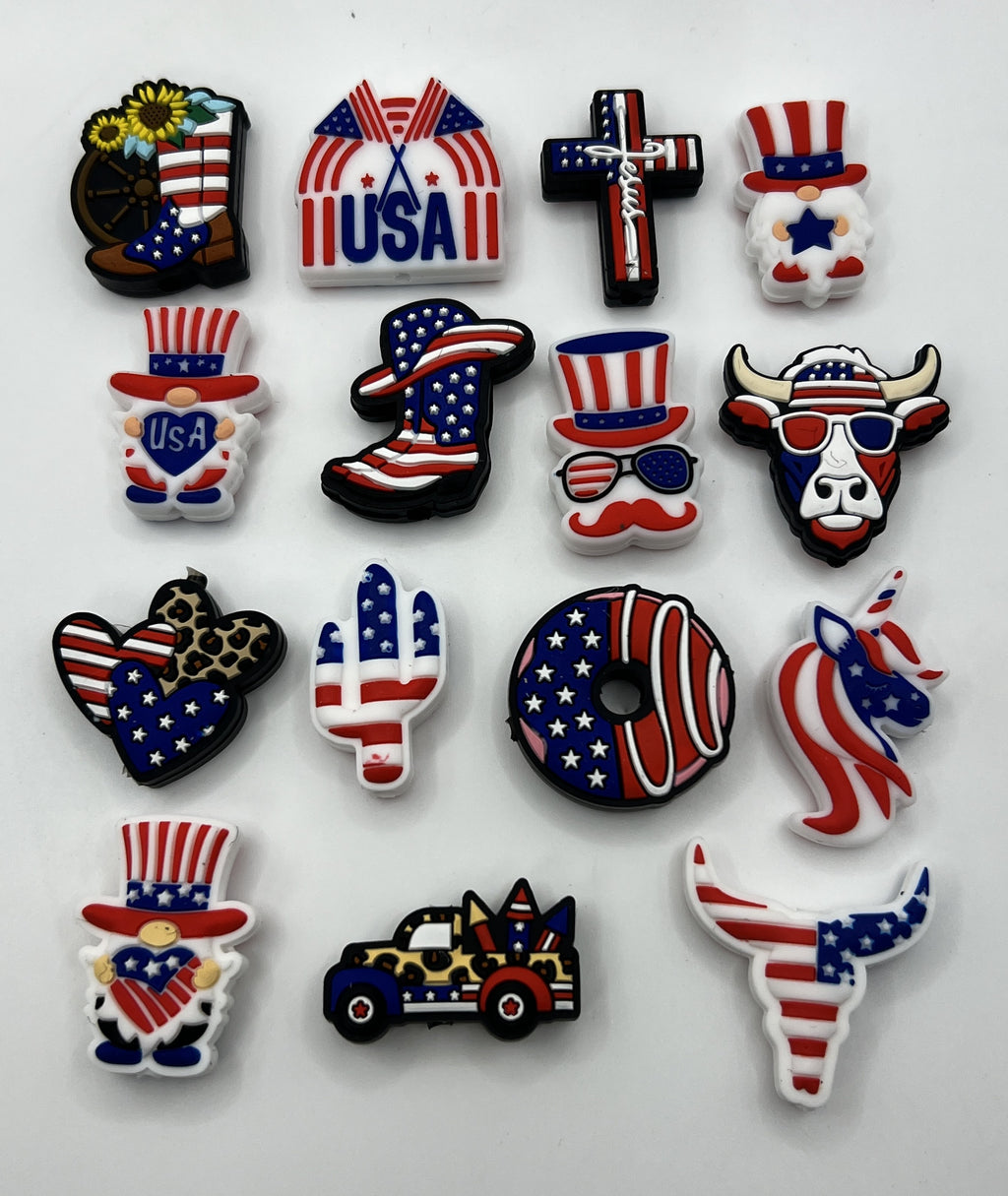 A set of fifteen patriotic silicone focal beads featuring various American-themed designs.