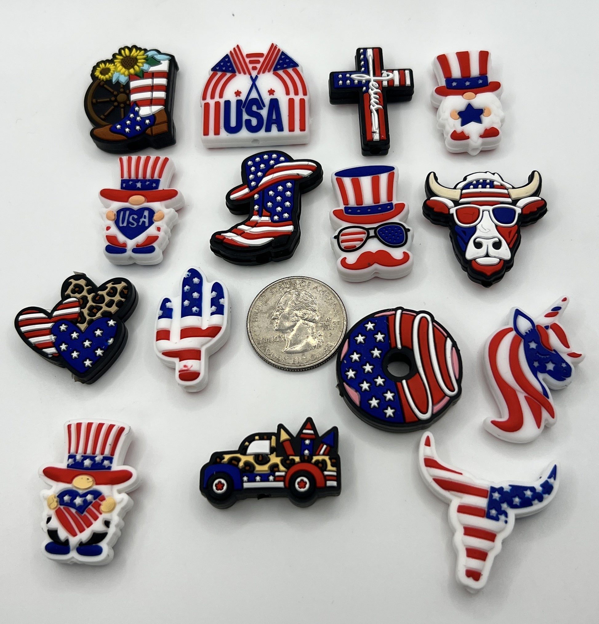 A set of fifteen patriotic silicone focal beads featuring various American-themed designs.