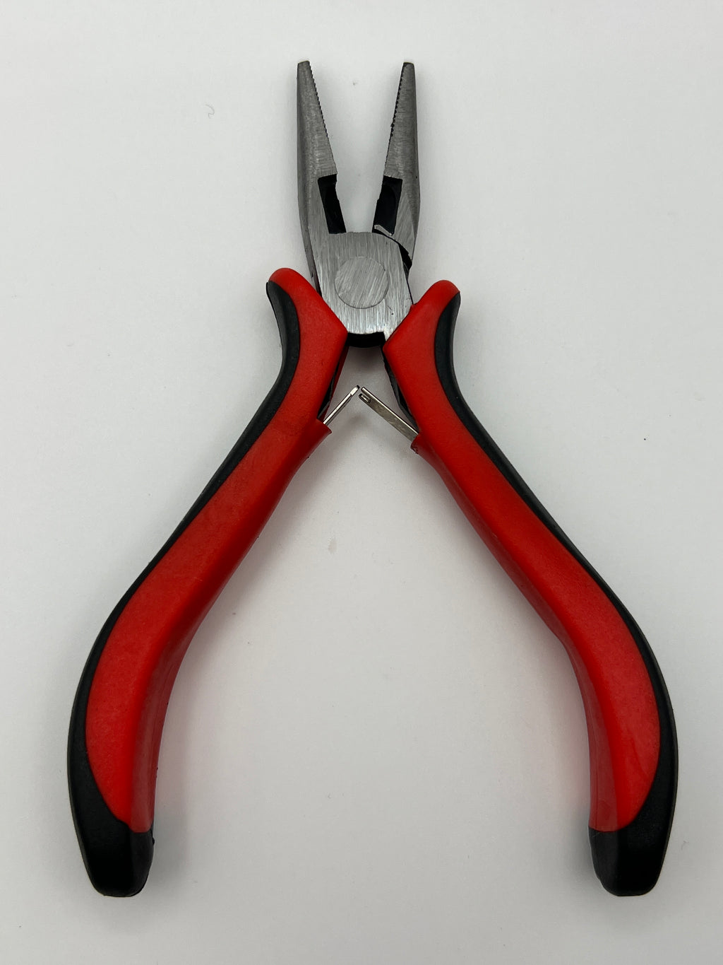 5-inch carbon steel needle nose pliers with red and black padded handles for jewelry making.