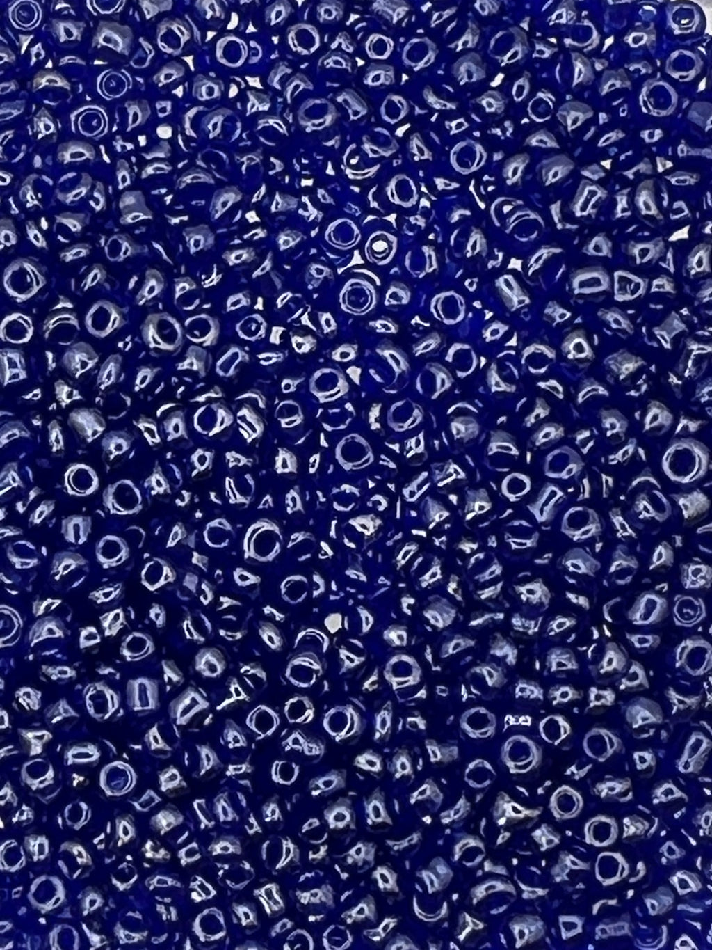 Close-up of 1 oz. 12/0 transparent lustered blue glass seed beads.