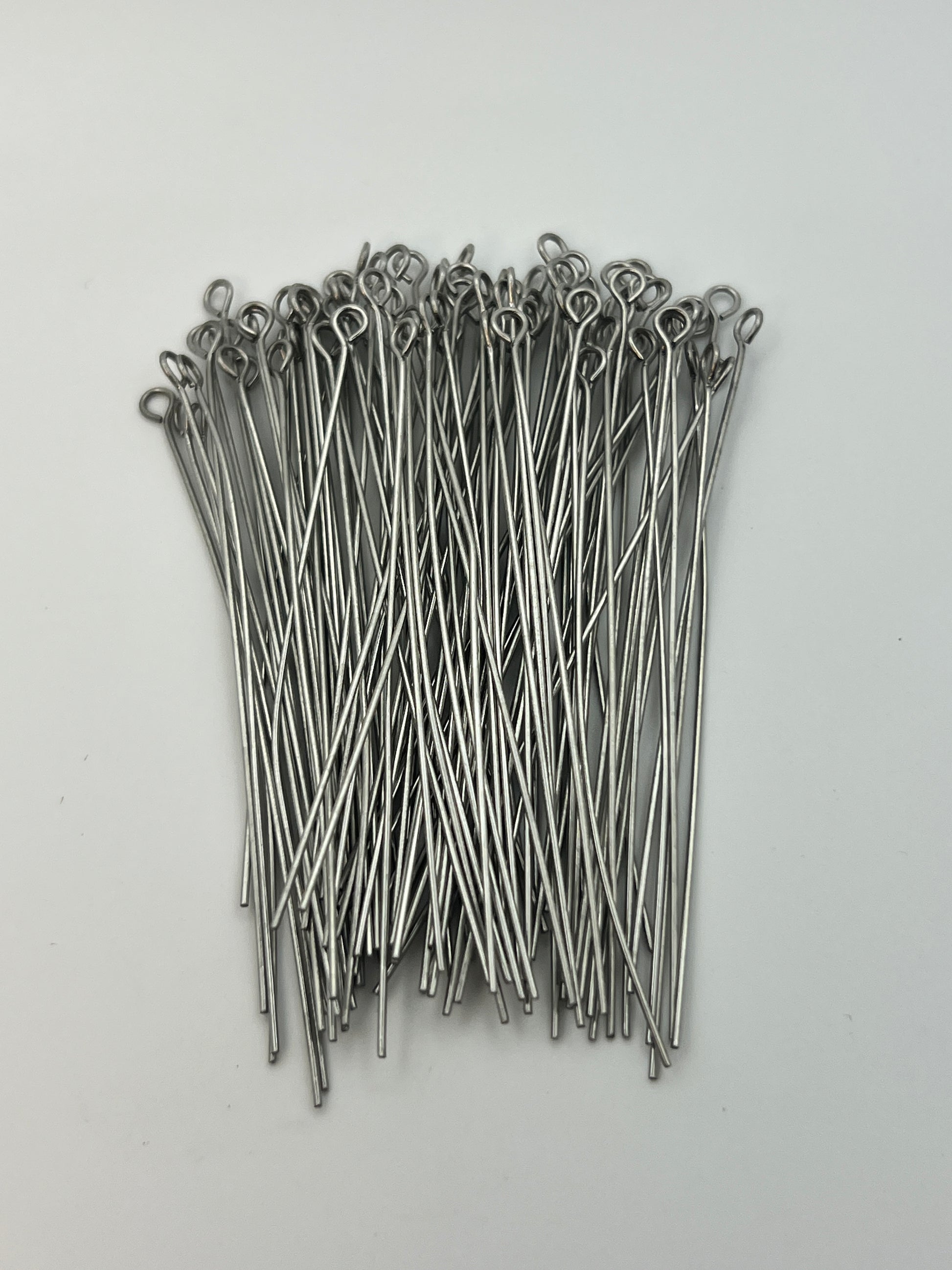 A bundle of 65mm 304 stainless steel eye pins with looped ends on a white background.