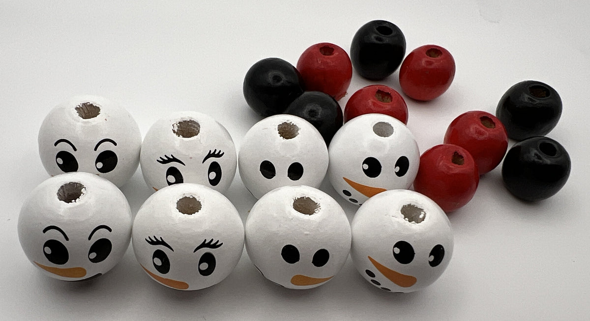 18-piece set of snowman face wood beads with coordinating red and black accent beads.