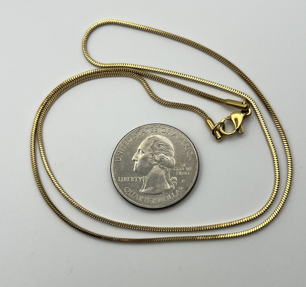 20-inch golden 304 stainless steel snake chain necklace next to a US quarter for scale.