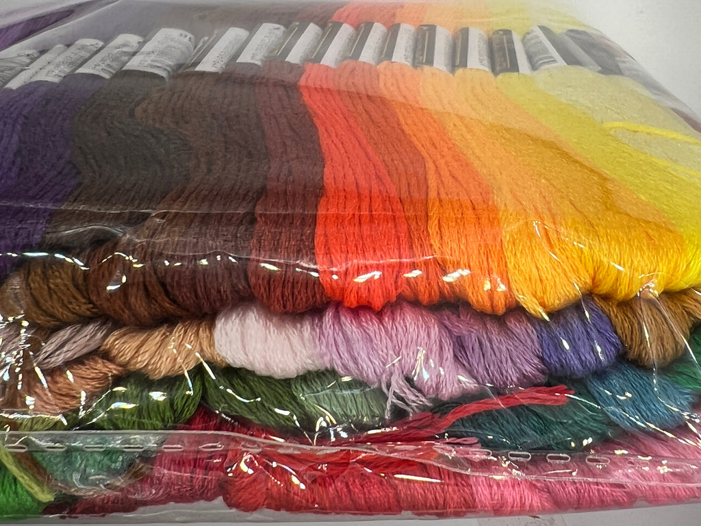 A large assortment of 100 colorful embroidery thread skeins in a clear plastic package.