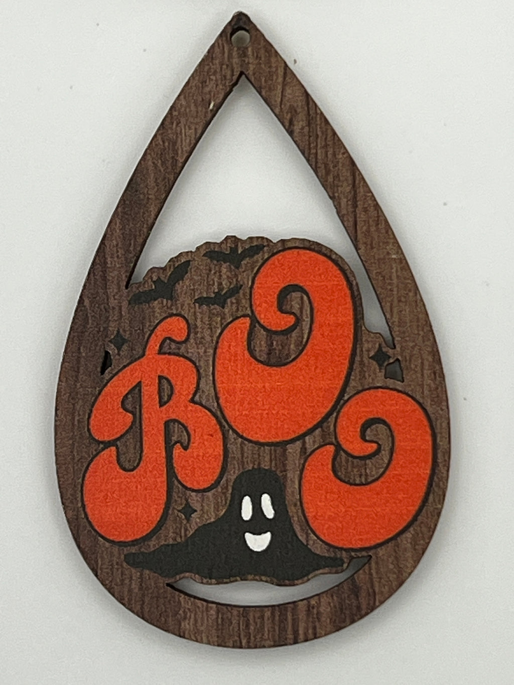 Teardrop-shaped wood pendant with orange 'BOO' text, a black ghost, and bats on a wood grain finish.