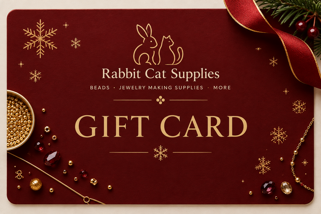 Rabbit Cat Supplies Gift Card on a red background with gold snowflakes and jewelry beads.